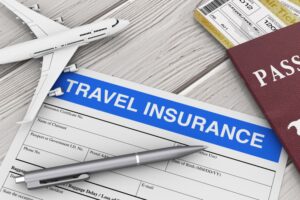 Close-up on a worn wooden table. A half-completed travel insurance form lies open, its ink slightly smudged. Beside it rests a miniature airplane model, gleaming silver in the light.